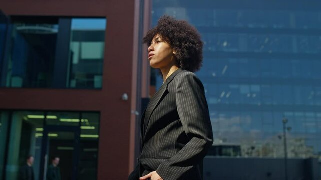 Businesswoman walking to work in cityscape