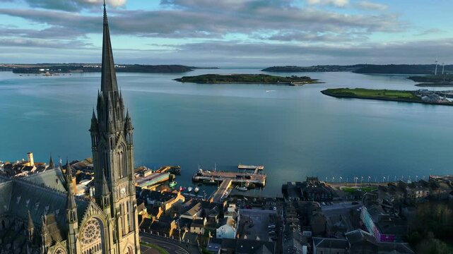 Cork county, Ireland, travel in Ireland, drone view of gothic cathedral in Cobh at sunset, establishing shot of Irish city of Cobh