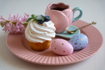 Easter 2025 table decoration for the holiday with flowers and accessories.