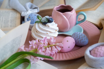 Easter 2025 table decoration for the holiday with flowers and accessories.