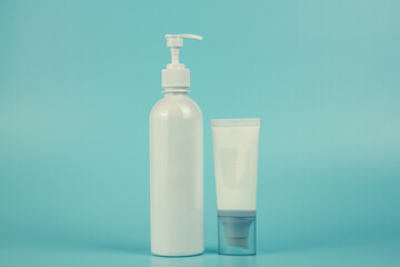 Empty tubes of cream on a blue background. Complex of creams for skin care.