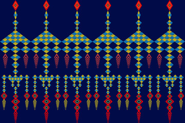 Ikat is a seamless shawl or waist wrap made of blue and yellow diamond squares with red and yellow tassels on a dark blue background.