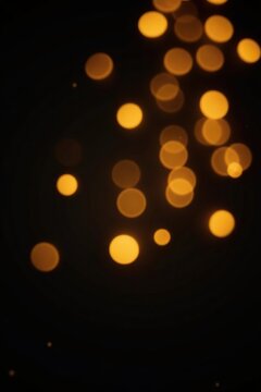 Luxurious golden bokeh lights over dark black background,  gold,  celebration