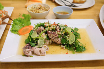Steamed squid with lemon and spicy thai squid salad with lime and herbs