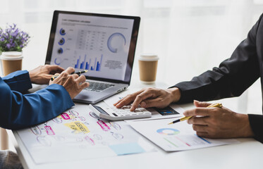 Businessman meeting with financial advisor, discussing analysis of financial charts in business...