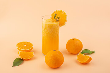 Glass of fresh tangerine juice and fruits