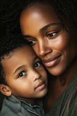 Tender moment between african descent mother and child embracing with love