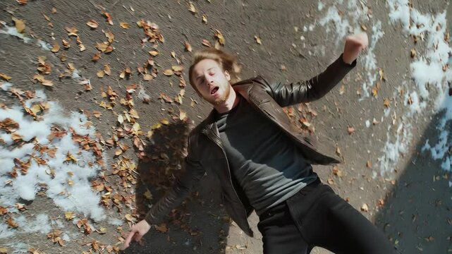 Man falling with euphoric expression in motion blur. Symbolizing altered perception, hallucinations, and extreme sensations associated with substance use.
