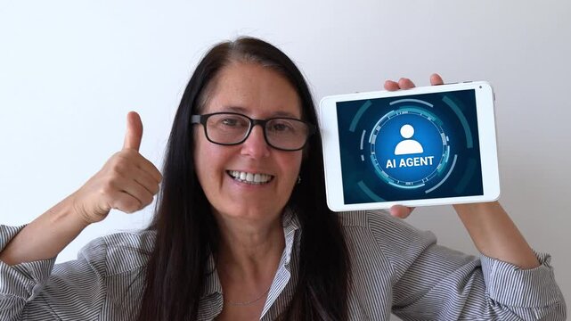 Using AI agents for your work and repetitive tasks. Happy woman holding up tablet with Artificial Intelligence agent on it, concept.