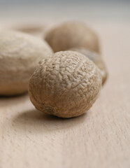 A close-up of whole nutmeg seeds