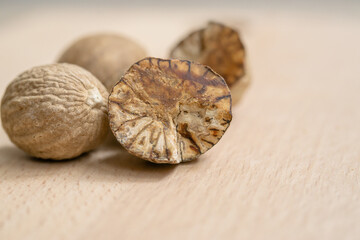  A close-up of whole and sliced nutmeg