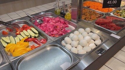 Self-service restaurant offering rice, potatoes, chicken wings and fried fish