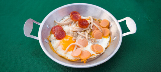 pan-fried egg with pork and toppings. Breakfast food in Thai style