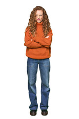 Full-body redhead portrait frowning face in displeasure, keeps arms folded.