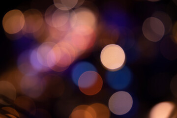 Fototapeta premium City lights with an intentional blur effect. Bokeh effect. Warm, bluish lights.
