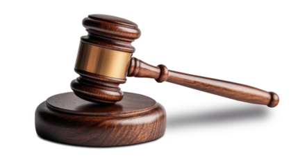 wooden gavel rests on circular base, symbolizing justice and authority in courtroom setting. polished surface reflects light, enhancing its elegant design and significance