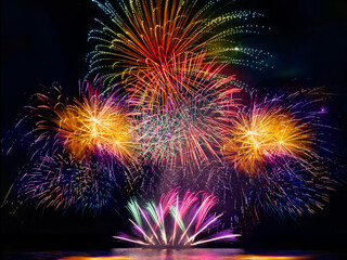 Obraz premium colourful firework display set for celebration happy new year and merry christmas and fireworks on black background