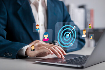 Target customers concept. Audience outreach and sales generation. Businessman using laptop with...
