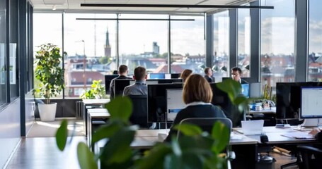 people working in office with green plants. concept of green sustainable environmental business office space workspace, employee wellness and social climate. esg environmental social governance