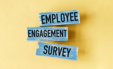 Three wooden blocks with the words employee engagement survey written on them