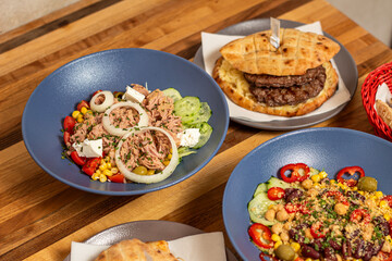 Delicious tuna salad with Assorted Side Dishes in the background