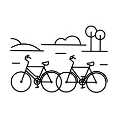 Two bicycles parked roadside, scenic countryside landscape