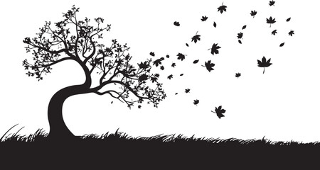 Silhouette of a tree with falling leaves in windy autumn scene for design use.
