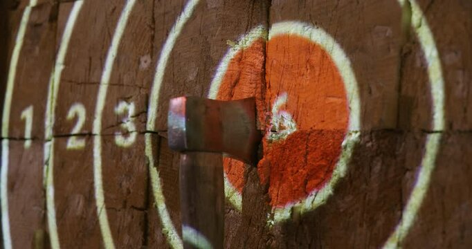 an axe thrown into digitally projected target