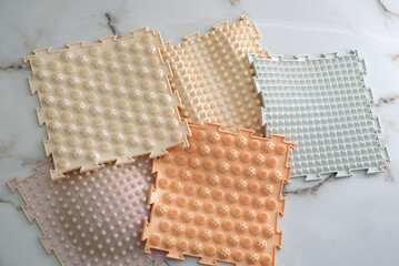 Orthopedic mat lying on the floor