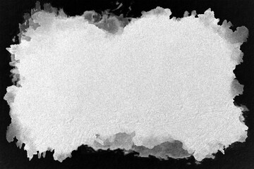 Monochrome image of isolated sand on black background.