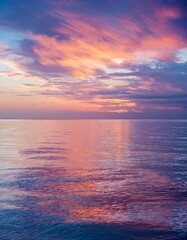 Obraz premium Serene Sunset Over Calm Ocean