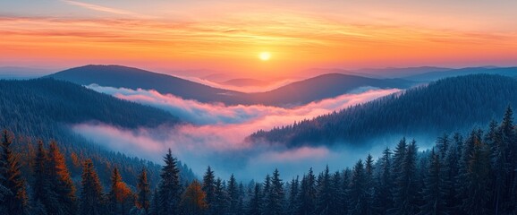 Obraz premium Sunrise over misty mountain peaks