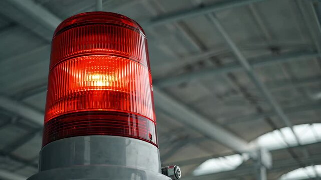 Red rotating beacon used for alert in industrial setting