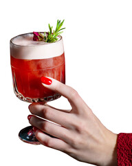 Girl in red holding a red cocktail in her hand with a manicure