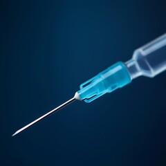 A close-up of a syringe's needle, showcasing its sharp tip and detailed design, set against a dark background, emphasizing its medical purpose.