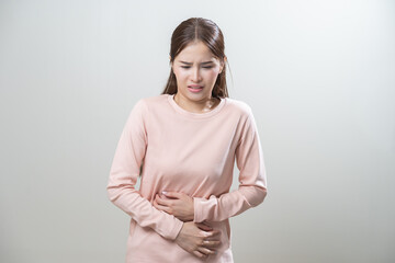 Flatulence asian young woman intolerance hand in stomach ache, suffer from food poisoning,...