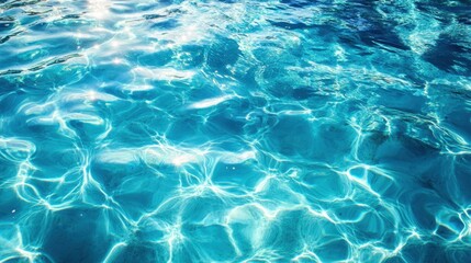 Fototapeta premium Sparkling turquoise water surface reflecting sunlight creating abstract patterns and shimmering light in a serene aquatic background