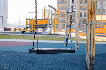 An Empty Swing at a Modern Playground is All Set and Ready for Lots of Fun and Enjoyment