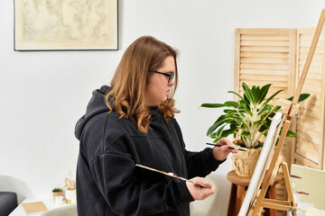 Young woman with Down syndrome creates vibrant art at home in a cozy, comfortable setting