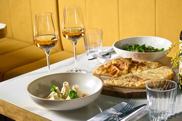Dinner at the restaurant, chef's dishes and glasses of wine. Romantic dinner.