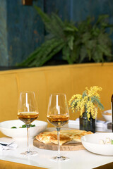 Dinner at the restaurant, chef's dishes and glasses of wine. Romantic dinner.