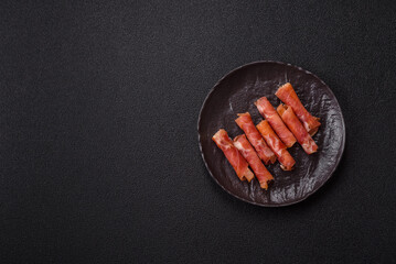 Cheese and meat, jamon or prosciutto rolled into a roll