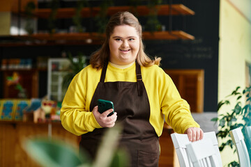 Young woman with Down syndrome radiates confidence in cozy cafe environment