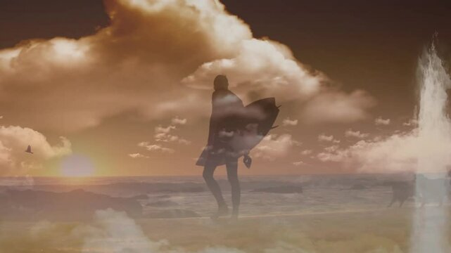 At sunset, silhouette of surfer holding board with ocean waves and clouds