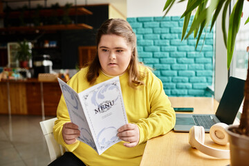 Young woman explores menu choices in a cozy cafe setting while exuding confidence