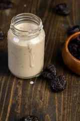 fresh cow's milk yogurt with prune flavor with dried plum slices