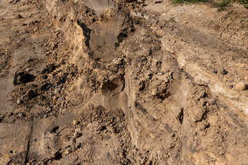 hole in the ground on the site of which a highway was started