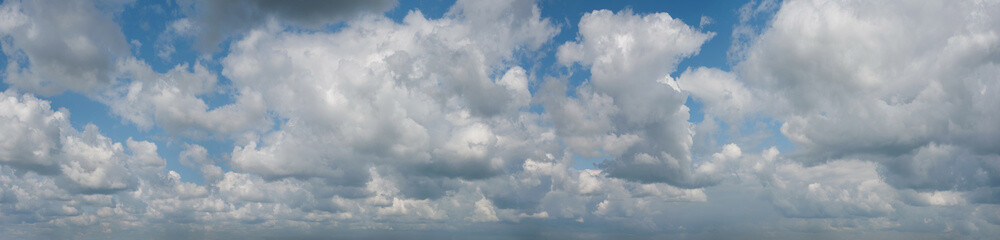 Panorama of beautiful cumulus clouds against the blue sky. Massive cumulus clouds. Weather forecast...