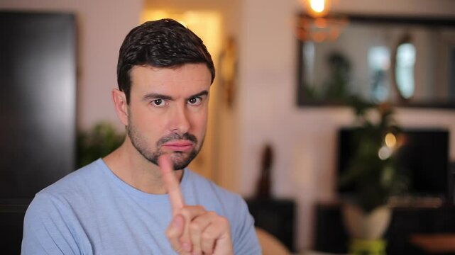 Stubborn man saying no with his finger movements 