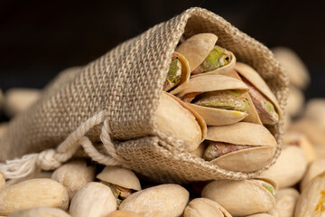 unpeeled pistachio nuts with cracked shells